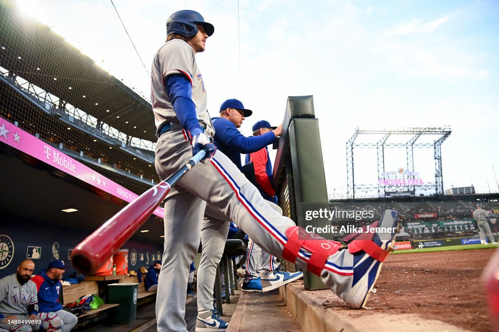 Texas Ranger Heim Jonah Heim of the Texas Rangers stands in the dugout during the... News ...