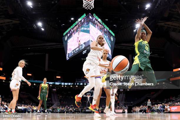 Yvonne Turner of the Seattle Storm and Moriah Jefferson of the Phoenix Mercury watch the ball fall out of bounds during the second quarter in a WNBA...