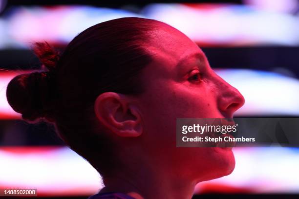 Diana Taurasi of the Phoenix Mercury listens to the national anthem before the game against the Seattle Storm in a WNBA preseason game at Climate...