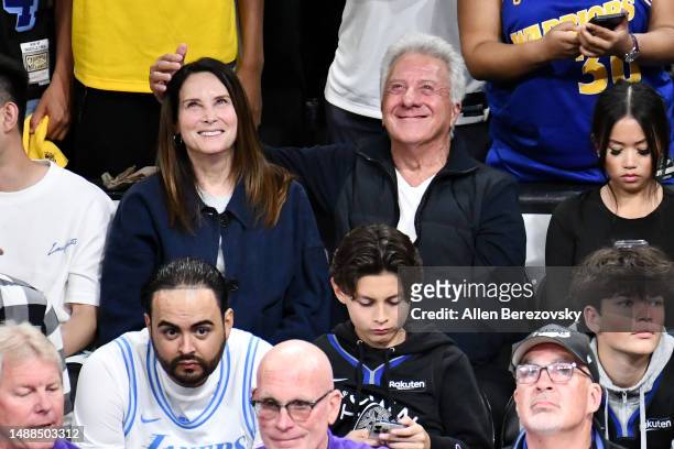 Dustin Hoffman and Lisa Hoffman attend a playoff basketball game between the Los Angeles Lakers and the Golden State Warriors at Crypto.com Arena on...