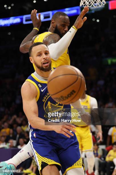 Stephen Curry of the Golden State Warriors reacts as he has his shot blocked by LeBron James of the Los Angeles Lakers during the fourth quarter in a...