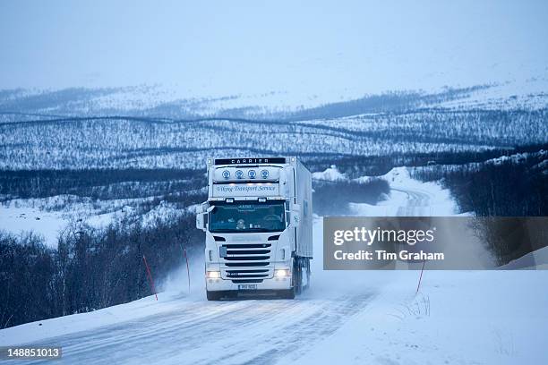 https://media.gettyimages.com/id/148851013/photo/finland-viking-transport-service-truck-travels-through-arctic-wilderness-at-nightfall-by.jpg?s=612x612&w=gi&k=20&c=TsTcG107vjr4YbCjsz0cBr2DTDIeXx7S_n-cBvDGL_Y=