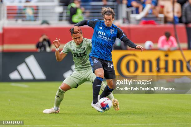Cade Cowell of San Jose Earthquakes controls the ball under pressure from Denil Maldonado of Los Angeles FC during a game between Los Angeles FC and...
