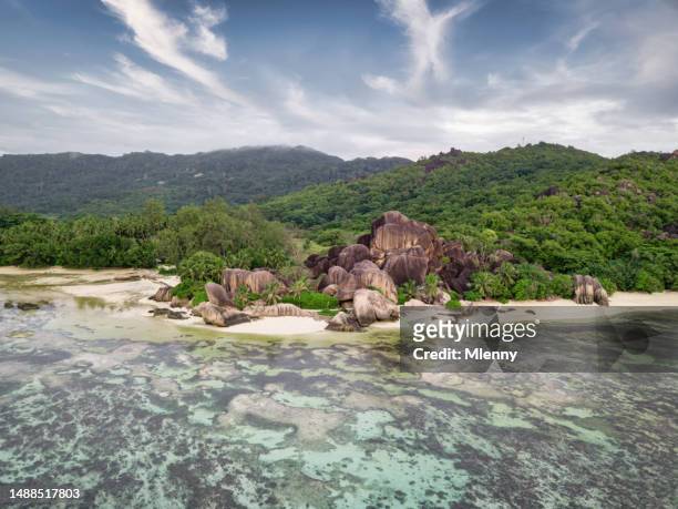 seychelles la digue island anse source d'argent reef and beach - mlenny stock pictures, royalty-free photos & images