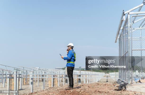 asian engineer checking progress and structure at construction site. - building foundations stock pictures, royalty-free photos & images