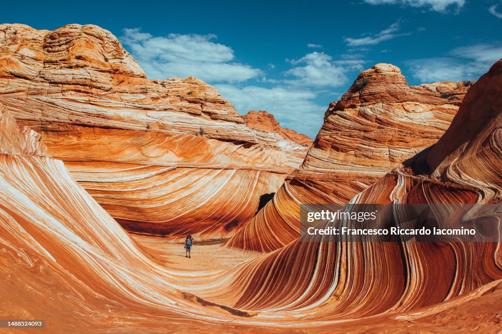 Walking on The Wave rock formation, Coyote Buttes north, Vermillion Cliffs, Arizona.