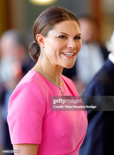 Crown Princess Victoria of Sweden attends a reception at Buckingham Palace for overseas guests ahead of the Coronation of King Charles III and Queen...