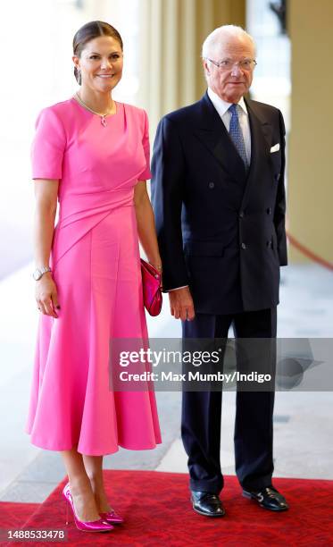 Crown Princess Victoria of Sweden and King Carl Gustaf XVI of Sweden attend a reception at Buckingham Palace for overseas guests ahead of the...
