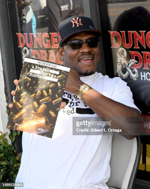 Jason R. Moore of the Netflix show 'Punisher' signs and promotes his Comic Book "A Prayer For The Hunted" on Free Comic Book Day 2023 held at Golden...