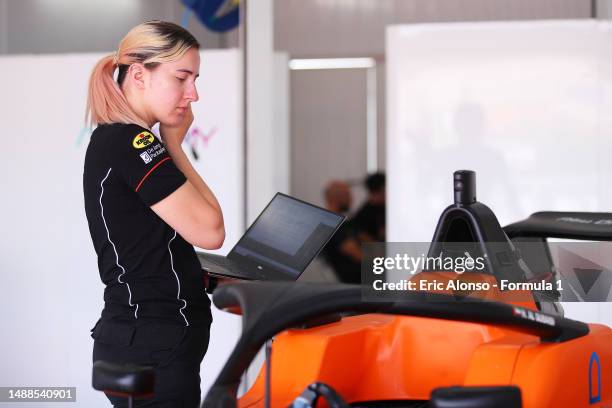The MP Motorsport team work in the garage during day one of F1 Academy Testing at Ricardo Tormo Circuit on May 09, 2023 in Valencia, Spain.