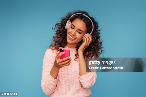 beautiful emotional woman listening to music - listening to music stock pictures, royalty-free photos & images