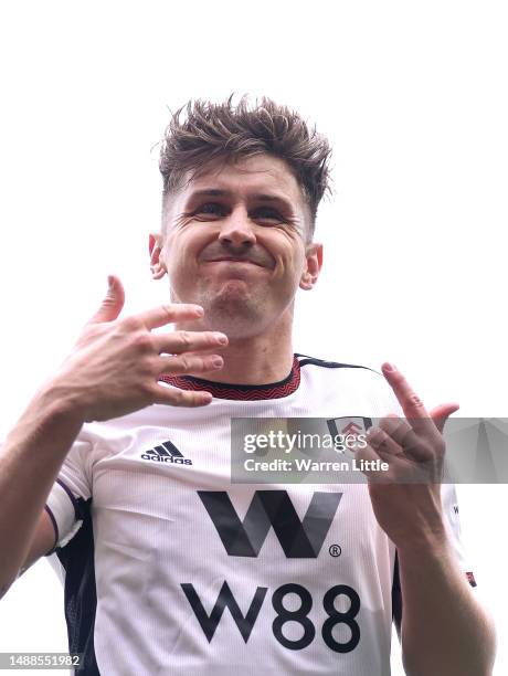 Tom Cairney of Fulham celebrates scoring the team's fourth goal during the Premier League match between Fulham FC and Leicester City at Craven...