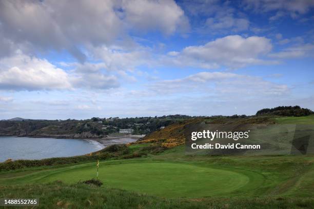 View from behind the green on the par 4, seventh hole with the par 4, eighth hole on the cliff edge behind looking towards Caswell Bay at Langland...