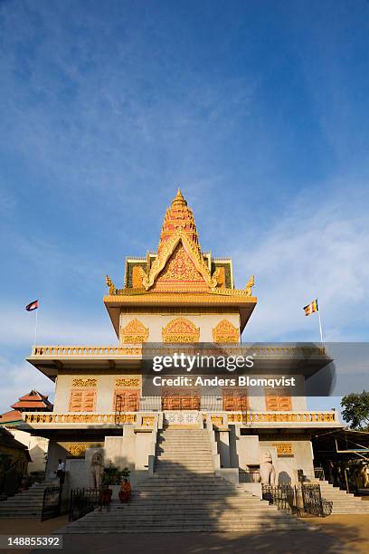 two monks sitting on the steps of wat ounalom. - wat ounalom stock pictures, royalty-free photos & images