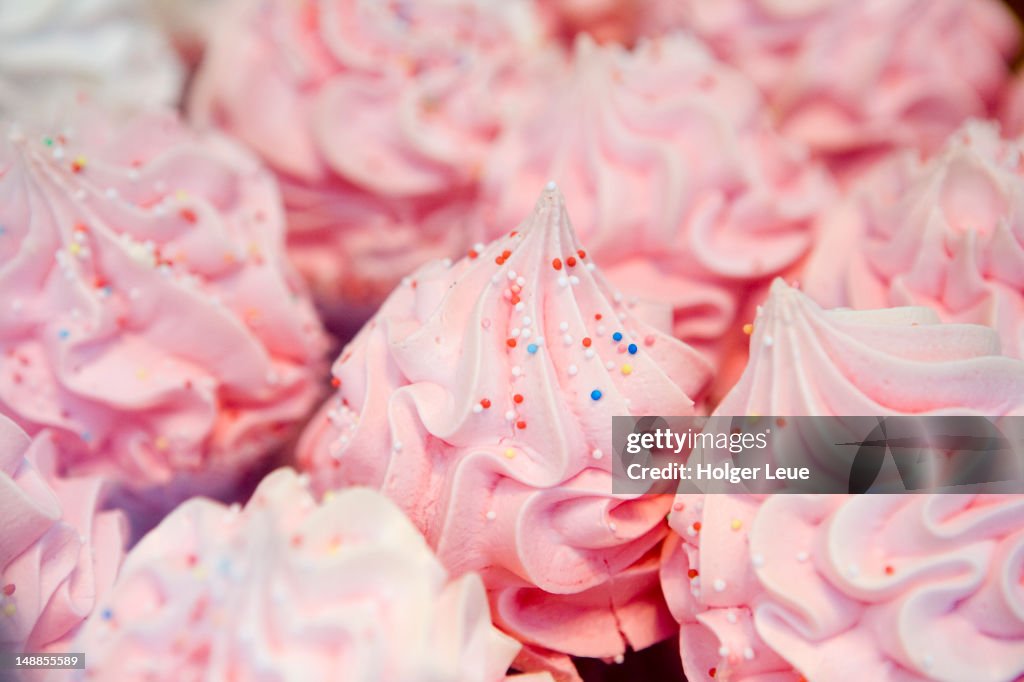 Pink icing on cakes.