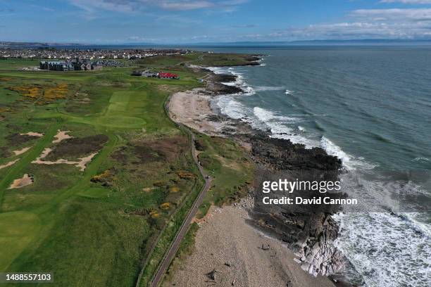 An aerial view from behind the green on the par 4, first hole looking towards the clubhouse and town of Porthcawl at Royal Porthcawl Golf Club on May...