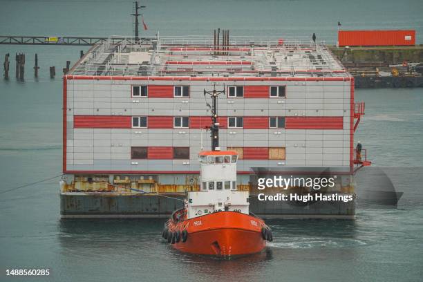 Bibby Stockholm, the barge which is to be used by the Home Office to house up to 500 male asylum seekers, arrives from Genoa on 9th May 2023, in...