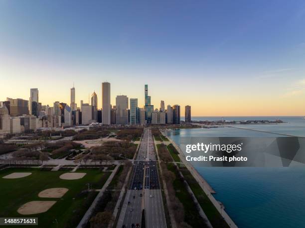 aerial view of the drone in chicago shows the skyscrapers, streets ,rivers and park in the center of the city near the beautiful lake michigan in illinois, usa. - tribune tower stock pictures, royalty-free photos & images