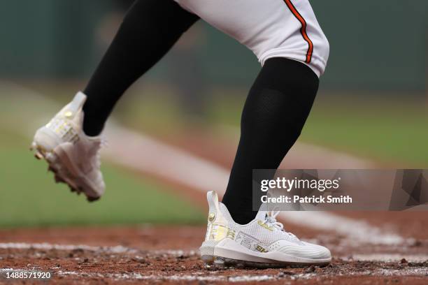 Detailed view of Under Armour baseball cleats are seen as a player bats at Oriole Park at Camden Yards on May 8, 2023 in Baltimore, Maryland.
