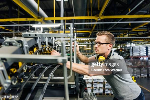 engineer checking machine parts of a heavy machine - 40 44 years blond hair mature man factory stock pictures, royalty-free photos & images