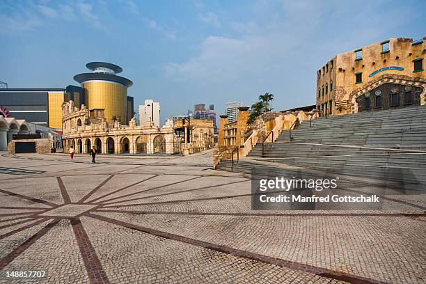 mock-up antique architecture of roman amphitheatre at fisherman's wharf, with sands casino gold glass panel in background. - sands hotel & casino stock pictures, royalty-free photos & images