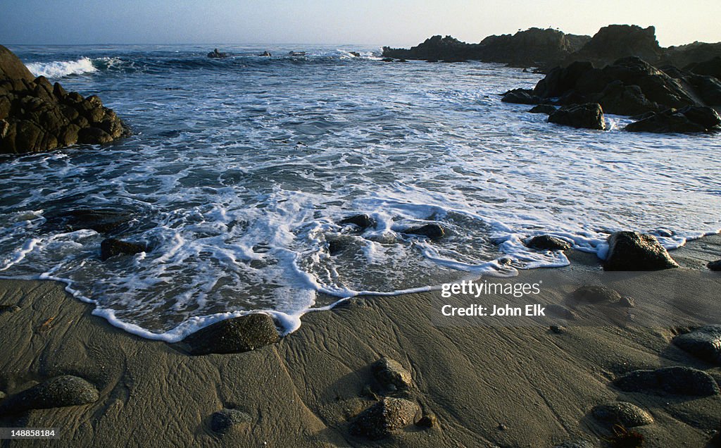 Lapping of the white capped waves of the Pacific Ocean - Monetery Bay, California