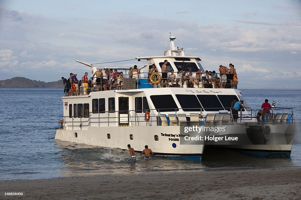 The Great Bay's Princess excursion catamaran departs beach.