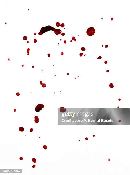 splashes and drops of blood floating on a white background - food stains stock-fotos und bilder