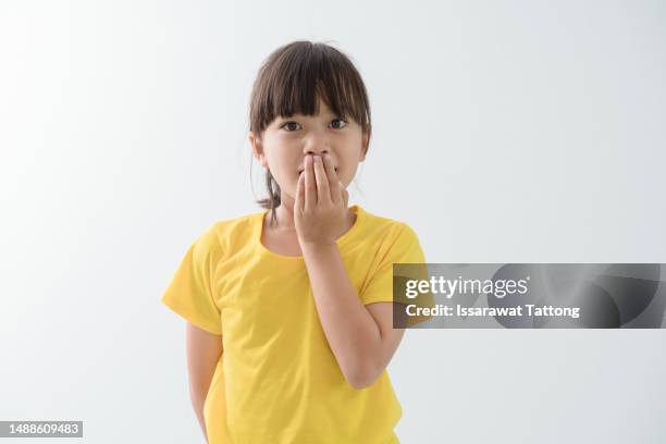 shocked kid girl over white background - kid shock face stock pictures, royalty-free photos & images