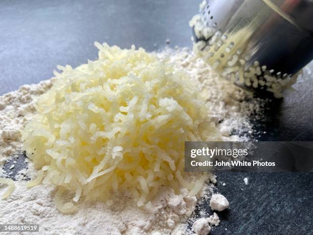 grated potatoes ready to be made into gnocchi. - grated stock pictures, royalty-free photos & images