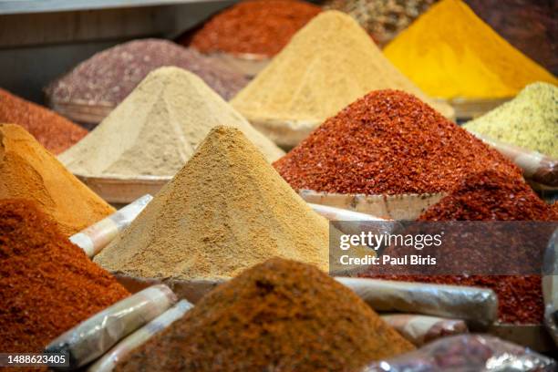 spice and seasonings in market. colorful spice and exotic herbs on display in spice bazaar in istanbul, turkey - turkey middle east stockfoto's en -beelden