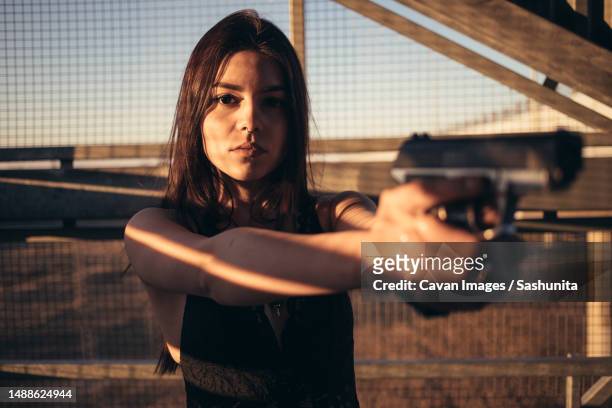a woman with a weapon is training to shoot - brest belarus stock pictures, royalty-free photos & images