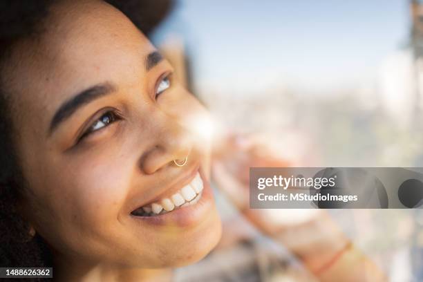 close up portrait of smiling woman - afro caribbean portrait stock pictures, royalty-free photos & images