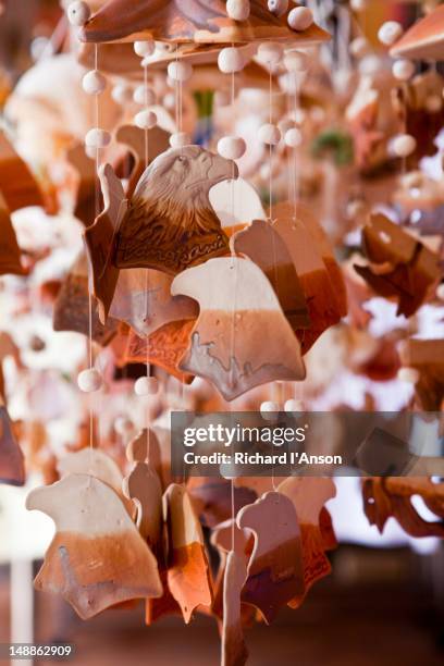souvenirs displayed outside shop in oriental village shopping centre, pantai kok. - pantai kok stock pictures, royalty-free photos & images