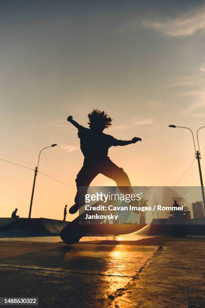 skateboarder in action. boy making skate air trick with grab - lima perú stock pictures, royalty-free photos & images