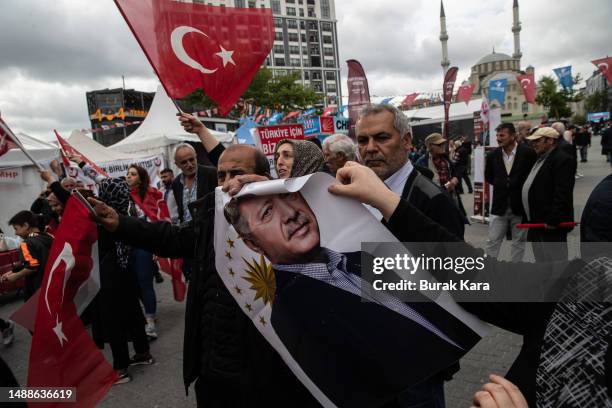 Woman holds Turkey's President Recep Tayyip Erdogan's poster during a campaign event on May 09, 2023 in Istanbul, Turkey. On May 14th, Turkey’s...