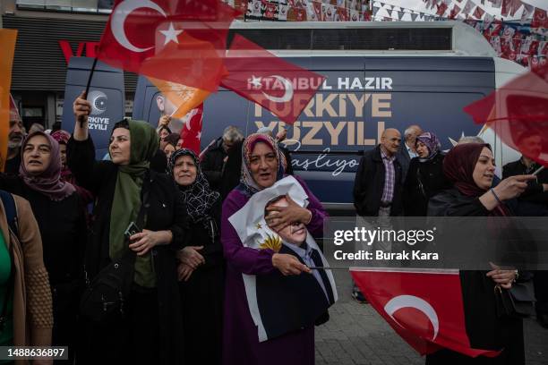 Woman holds Turkey's President Recep Tayyip Erdogan's poster during a campaign event on May 09, 2023 in Istanbul, Turkey. On May 14th, Turkey’s...