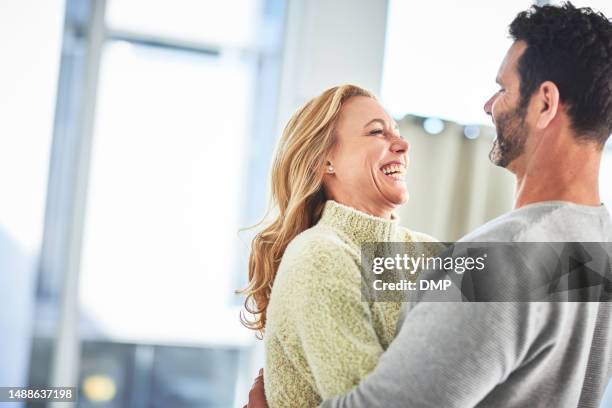 love, happiness and couple laughing in home, romance and bonding together in house with smile on face. marriage, happy woman and man joke in living room, romantic quality time and hugging in morning. - girlfriend meme stock pictures, royalty-free photos & images