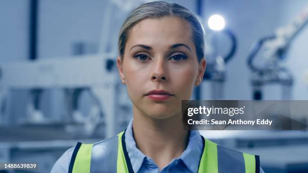 serious woman, portrait and robotics technology engineer in a automation and futuristic development lab. female worker, face and employee proud from engineering innovation and biotechnology work - storage solutions stock pictures, royalty-free photos & images