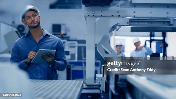 factory, tablet and machine of engineering man in maintenance, programming or manufacturing for industry 4.0. technician person working with metal, electronics or automation on digital technology app - industry 4 0 imagens e fotografias de stock