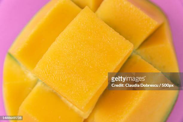 close-up of mango slices in plate,romania - mango piece stock-fotos und bilder