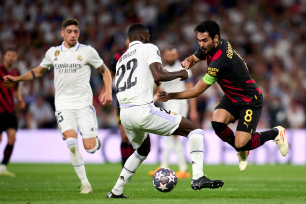 Antonio Rudiger of Real Madrid battle for the ball with Ilkay Gundogan of Manchester City FC during the UEFA Champions League semi-final first leg...