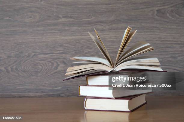 close-up of books on table,romania - open romania imagens e fotografias de stock