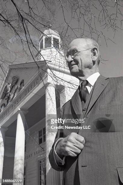 Businessman and philanthropist John Ward Melville stands in front of the Stony Brook, New York post office building on November 13, 1966.