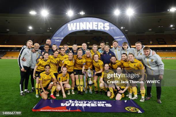 Wolverhampton Wanderers celebrate with the trophy following their teams victory during the Birmingham County Cup Women's Final match between...