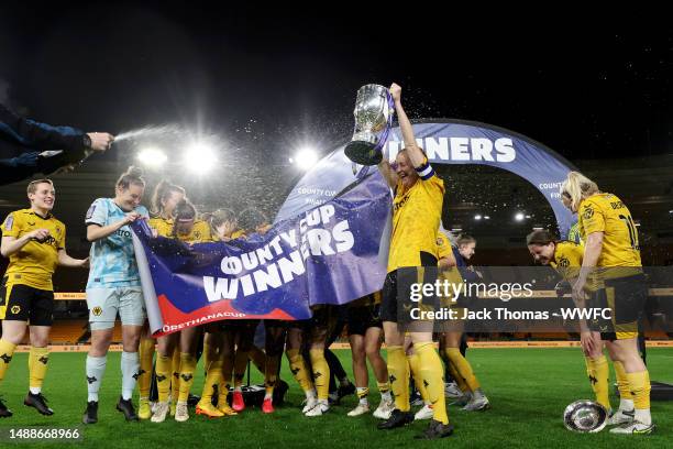 Wolverhampton Wanderers celebrate with the trophy following their teams victory during the Birmingham County Cup Women's Final match between...