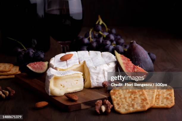 high angle view of various cheese and cheese on table,romania - brie stock-fotos und bilder