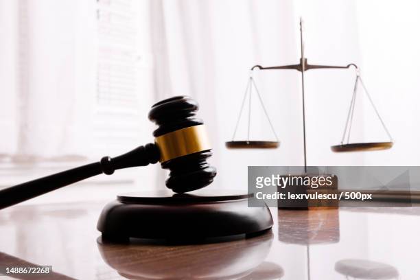 business and lawyers discussing contract papers with brass scale on desk in office law,legal services,advice,justice and law concept picture with film grain effect,romania - gavel courtroom stock pictures, royalty-free photos & images