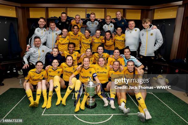 Wolverhampton Wanderers pose for a group photo in the changing room with the trophy following their victory during the Birmingham County Cup Women's...