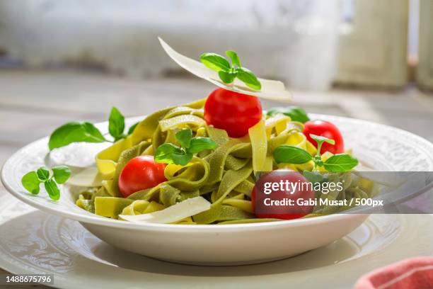 close-up of salad in plate on table - tagliatelle fotografías e imágenes de stock